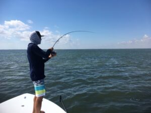 Mick with a redfish on the fly fishing gallery