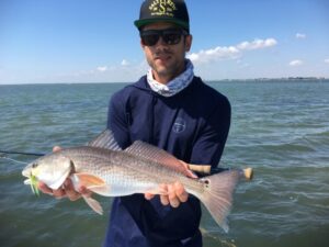 Mick with a big redfish in the fly fishing gallery